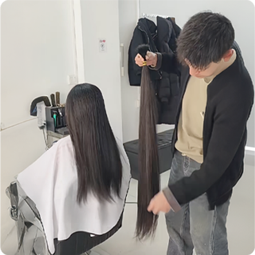 Ethical sourcing of raw single donor ponytail cut directly from the donor for premium 100% virgin remy cuticle human hair extensions B2B wholesale.